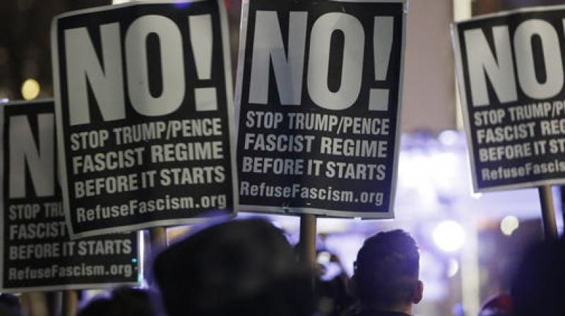 People attending an anti-Trump rally and protest. (Photo: AP) People attending an anti-Trump rally and protest. (Photo: AP)
