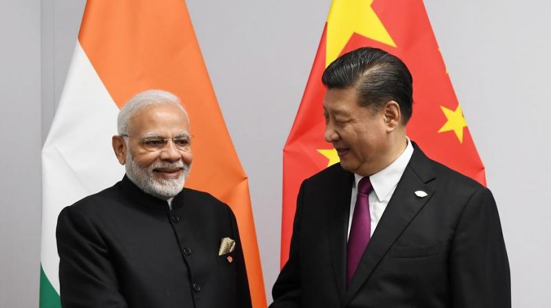 Modi told Xi that he was looking forward to host him for an informal summit next year. (Photo: @PMO/Twitter) Modi told Xi that he was looking forward to host him for an informal summit next year. (Photo: @PMO/Twitter)