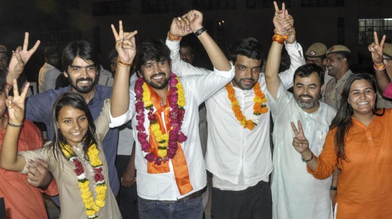 ABVP's panel's newly elected DUSU President Ankiv Basoya (3rd R) Shakti Singh (Vice President) and Joint Secretary, Jyoti Choudhary (L) celebrate after DUSU Election Result 2018. (Photo: PTI) ABVP's panel's newly elected DUSU President Ankiv Basoya (3rd R) Shakti Singh (Vice President) and Joint Secretary, Jyoti Choudhary (L) celebrate after DUSU Election Result 2018. (Photo: PTI)