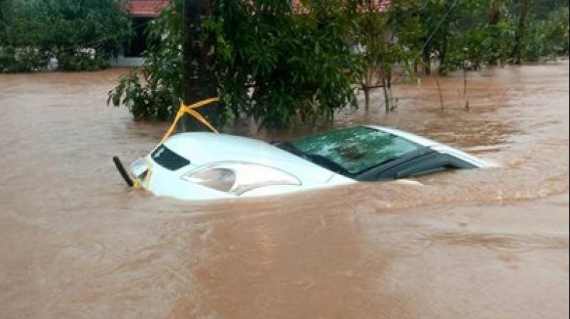A car is seen submerged in flood water after heavy rainfall, at Vythiri in Wayanad district of Kerala. (Photo: PTI) A car is seen submerged in flood water after heavy rainfall, at Vythiri in Wayanad district of Kerala. (Photo: PTI)
