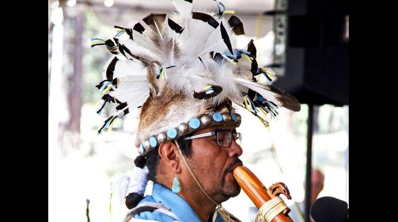 The Museum of Northern Arizona shows an unidentified man wearing a headpiece fashioned out of an animal hide at the Navajo Festival of Arts and Culture in Flagstaff, Arizona. (Photo: AP) The Museum of Northern Arizona shows an unidentified man wearing a headpiece fashioned out of an animal hide at the Navajo Festival of Arts and Culture in Flagstaff, Arizona. (Photo: AP)