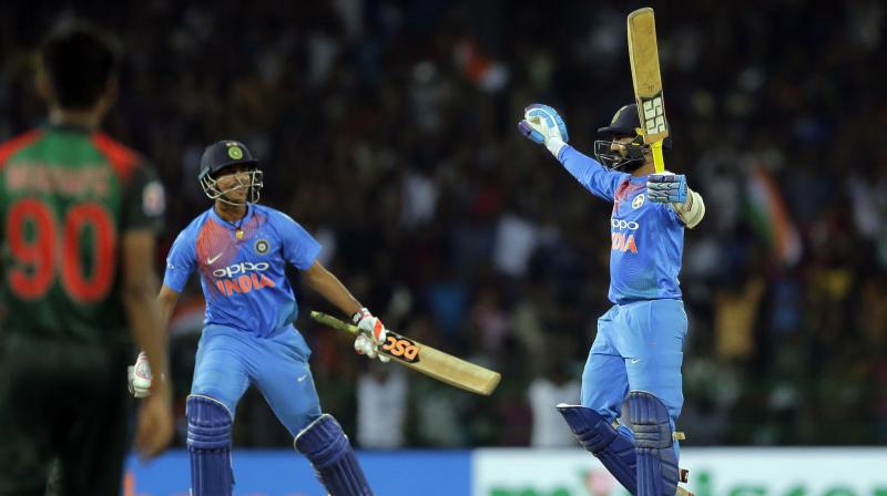 Dinesh Karthik celebrates after completing the four-wicket win over Bangladesh on Sunday. (Photo: AP) Dinesh Karthik celebrates after completing the four-wicket win over Bangladesh on Sunday. (Photo: AP)
