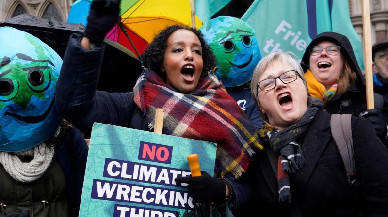 Campaigners against Heathrow expansion celebrate outside the Royal Courts of Justice in London. AFP Photo Campaigners against Heathrow expansion celebrate outside the Royal Courts of Justice in London. AFP Photo