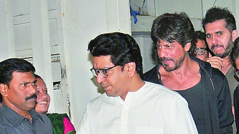 Shah Rukh Khan (in black) after meeting with Raj Thackerey in Mumbai Shah Rukh Khan (in black) after meeting with Raj Thackerey in Mumbai