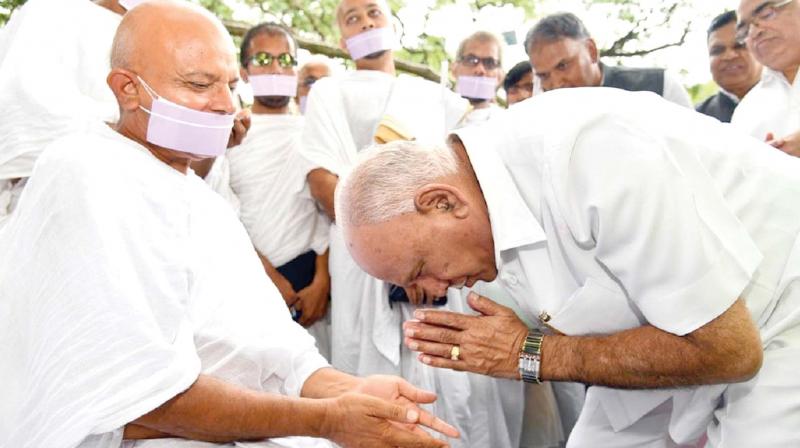 Acharya Mahashraman who is on Ahimsa Yatra being greeted by state BJP president B.S. Yeddyurappa in Bengaluru on Sunday (Photo: KPN) Acharya Mahashraman who is on Ahimsa Yatra being greeted by state BJP president B.S. Yeddyurappa in Bengaluru on Sunday (Photo: KPN)