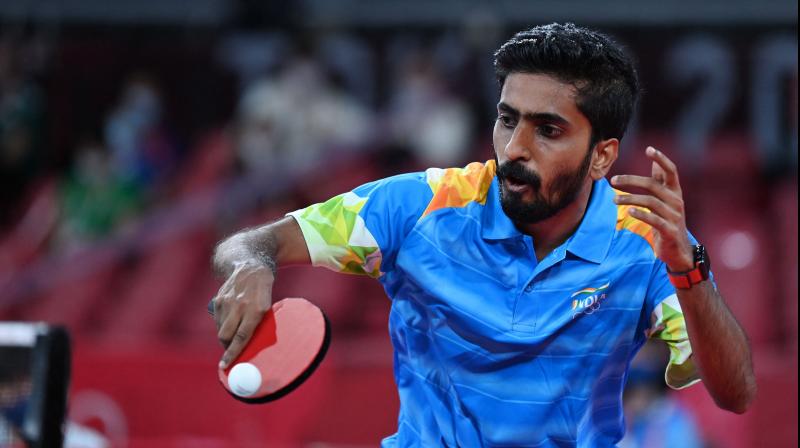 India's Sathiyan Gnanasekaran hits a shot against Hong Kong's Lam Siu-hang during his men's singles round 2 table tennis match at the Tokyo Metropolitan Gymnasium during the Tokyo 2020 Olympic Games in Tokyo on July 25, 2021. (Photo: AFP) India's Sathiyan Gnanasekaran hits a shot against Hong Kong's Lam Siu-hang during his men's singles round 2 table tennis match at the Tokyo Metropolitan Gymnasium during the Tokyo 2020 Olympic Games in Tokyo on July 25, 2021. (Photo: AFP)