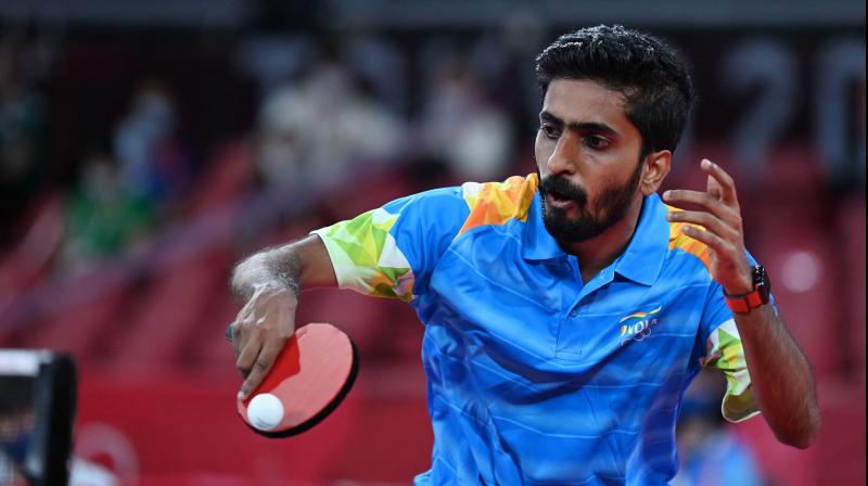 Indias Sathiyan Gnanasekaran hits a shot against Hong Kongs Lam Siu-hang during his mens singles round 2 table tennis match at the Tokyo Metropolitan Gymnasium during the Tokyo 2020 Olympic Games in Tokyo on July 25, 2021. (Photo: AFP)