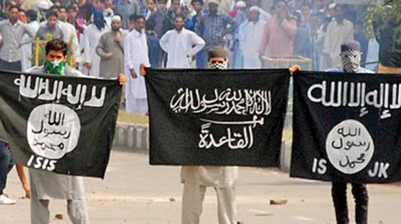 Kashmiri youth hold the Islamic State's flag in a protest march in Jammu and Kashmir (Photo: PTI) Kashmiri youth hold the Islamic State's flag in a protest march in Jammu and Kashmir (Photo: PTI)