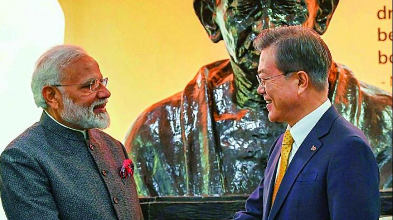 PM Narendra Modi and South Korean President Moon Jae-in after unveiling the bust of Mahatma Gandhi at the Yonsei University in Seoul on Thursday. (Photo: PTI) PM Narendra Modi and South Korean President Moon Jae-in after unveiling the bust of Mahatma Gandhi at the Yonsei University in Seoul on Thursday. (Photo: PTI)