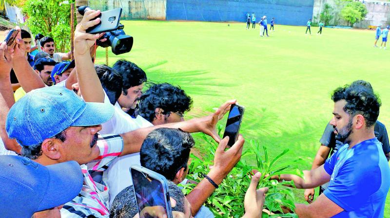 India opener Rohit Sharma signs autographs during a training session in Visakhapatnam on Saturday. (K. Murali Krishna) India opener Rohit Sharma signs autographs during a training session in Visakhapatnam on Saturday. (K. Murali Krishna)