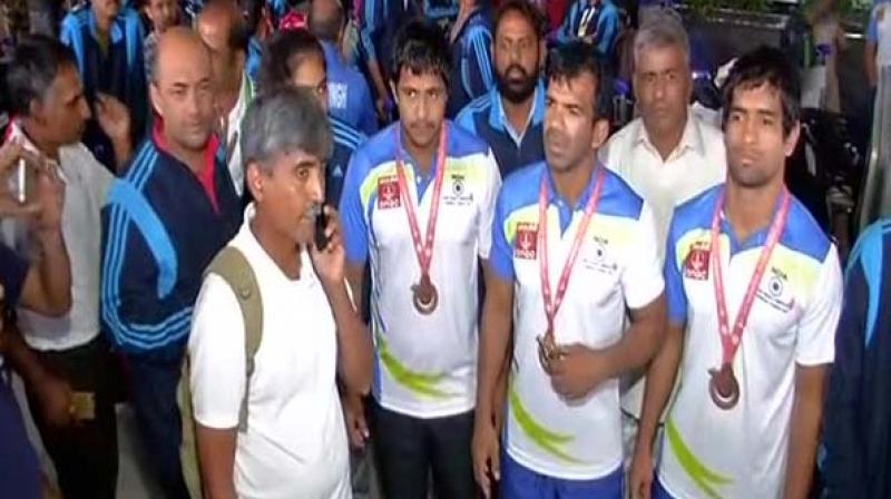 The Indian Deaflympics team protest at the Delhi Airport. (Photo: ANI/Twitter) The Indian Deaflympics team protest at the Delhi Airport. (Photo: ANI/Twitter)