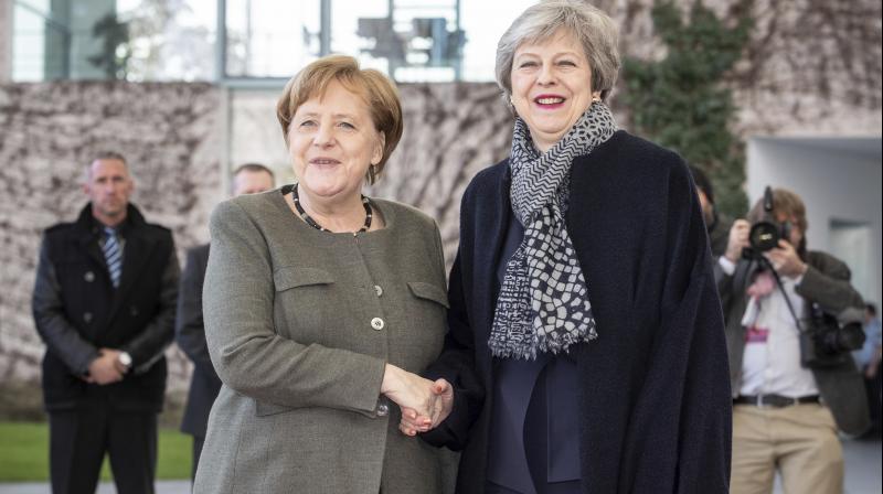 German Chancellor Angela Merkel, left, welcomes British Prime Minister Theresa May prior to a meeting at the chancellery in Berlin. (Photo:AP) German Chancellor Angela Merkel, left, welcomes British Prime Minister Theresa May prior to a meeting at the chancellery in Berlin. (Photo:AP)