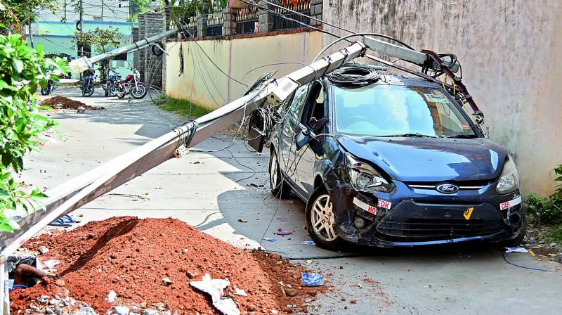 A damaged car is parked at the accident site at Ampro Colony, Karmanghat in Hyderabad on Wednesday. (Photo: DC) A damaged car is parked at the accident site at Ampro Colony, Karmanghat in Hyderabad on Wednesday. (Photo: DC)
