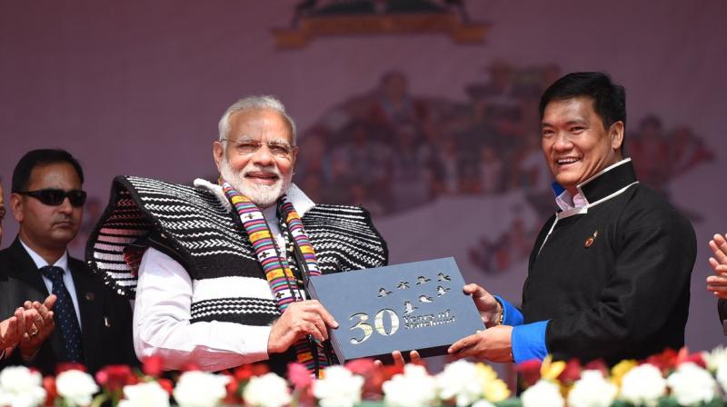 PM Narendra at the inauguration of Dorjee Khandu State Convention Centre in Itanagar. (Photo: PIB/Twitter) PM Narendra at the inauguration of Dorjee Khandu State Convention Centre in Itanagar. (Photo: PIB/Twitter)