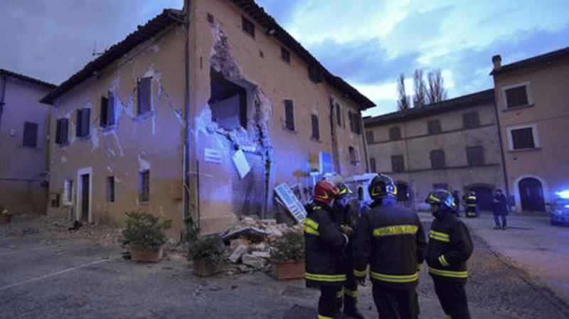 After a night of heavy rain, rescuers workers were trying to assess the full extent of the latest disaster in central Italy, which toppled buildings and injured dozens. (Photo: AP) After a night of heavy rain, rescuers workers were trying to assess the full extent of the latest disaster in central Italy, which toppled buildings and injured dozens. (Photo: AP)