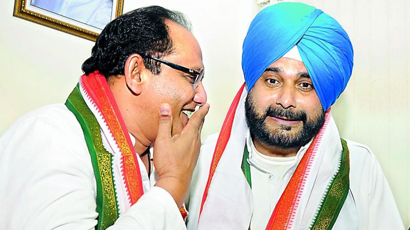 Cricketers-turned-politicians Mohammed Azharuddin and Navjot Singh Sidhu share a lighter moment at Gandhi Bhavan on Friday. (Deepak Deshpande) Cricketers-turned-politicians Mohammed Azharuddin and Navjot Singh Sidhu share a lighter moment at Gandhi Bhavan on Friday. (Deepak Deshpande)