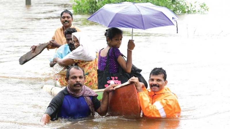 Rescue personnel evacuate local residents in a boat from a residential area at Chengannur in Alappuzha on Saturday. (Photo: PRD) Rescue personnel evacuate local residents in a boat from a residential area at Chengannur in Alappuzha on Saturday. (Photo: PRD)