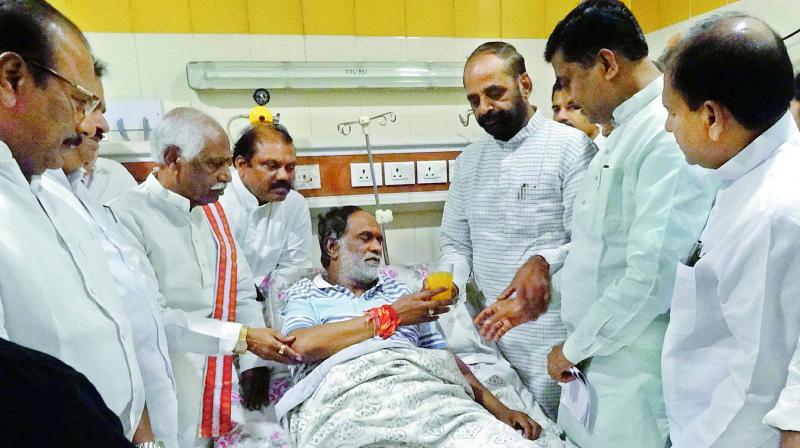 BJP TS president K. Laxman calls off his five-day fast by accepting a glass of juice from Union minister Hansraj Gangaram Ahir at Nims on Friday. BJP TS president K. Laxman calls off his five-day fast by accepting a glass of juice from Union minister Hansraj Gangaram Ahir at Nims on Friday.