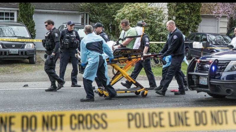 The incident unfolded in a northeastern Seattle neighbourhood when the suspect approached a motorist at an intersection and shot her before walking into the street and firing on the bus, police said in a statement. (Photo: AP) The incident unfolded in a northeastern Seattle neighbourhood when the suspect approached a motorist at an intersection and shot her before walking into the street and firing on the bus, police said in a statement. (Photo: AP)