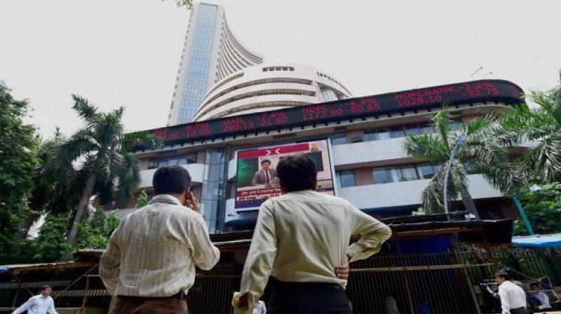 Investors at BSE check changing share prices. (Photo: PTI) Investors at BSE check changing share prices. (Photo: PTI)
