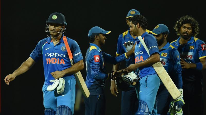 Despite a valiant effort by Akila Dhananjaya, India managed to limp over the finish line, with the watchful Mahendra Singh Dhoni and Bhuvneshwar Kumar at the crease. (Photo: AP) Despite a valiant effort by Akila Dhananjaya, India managed to limp over the finish line, with the watchful Mahendra Singh Dhoni and Bhuvneshwar Kumar at the crease. (Photo: AP)