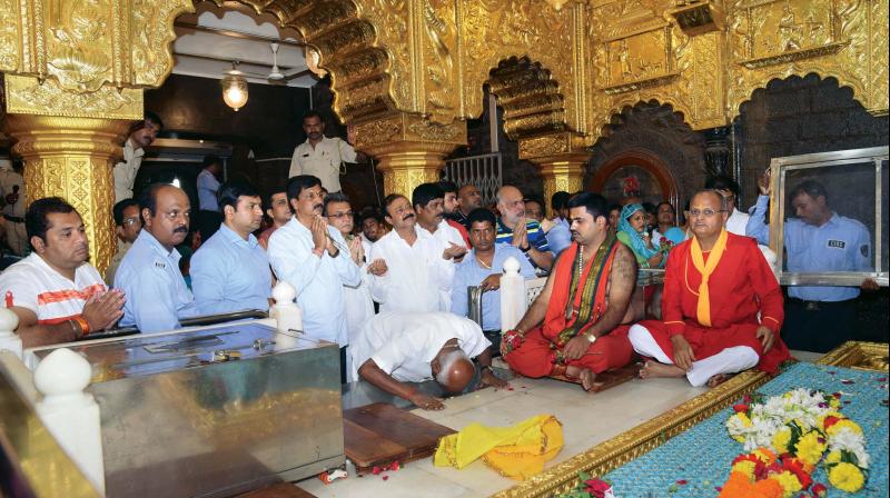 Rebel MLAs at Sai Baba temple at Shiradi in Maharashtra on Saturday. (Photo: PTI) Rebel MLAs at Sai Baba temple at Shiradi in Maharashtra on Saturday. (Photo: PTI)