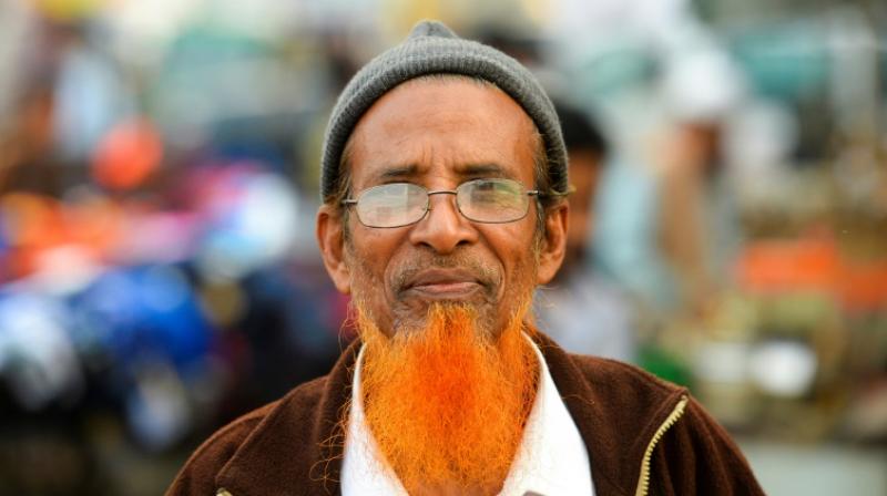 The powder turns the grey hair red but does not change the remaining black hair. (Photo: AFP) The powder turns the grey hair red but does not change the remaining black hair. (Photo: AFP)