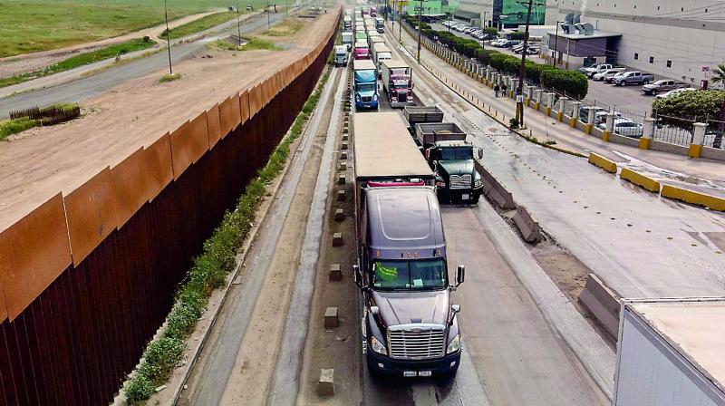 An April 4 picture shows cargo trucks lined up to cross to the US near the US-Mexico border at Otay Mesa crossing port in Tijuana, Baja California state, Mexico. ( Photo: AFP) An April 4 picture shows cargo trucks lined up to cross to the US near the US-Mexico border at Otay Mesa crossing port in Tijuana, Baja California state, Mexico. ( Photo: AFP)