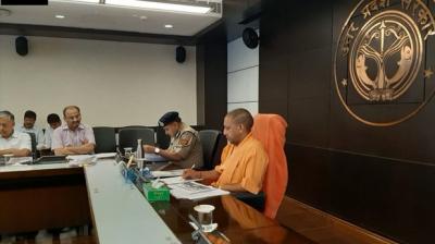 Uttar Pradesh Chief Minister Yogi Adityanath held a meeting with Chief Secretary and senior police officials on Monday on the issue of women security in the state. (Photo: ANI)