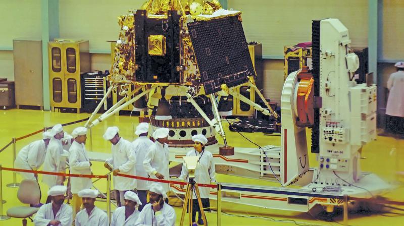 Isro personnel work on the orbiter vehicle of Chandrayaan-2, India’s first moon lander and rover mission planned and developed by Isro at Isro Satellite Integration and test establishment (ISITE), in Bengaluru, on Wednesday. — PTI Isro personnel work on the orbiter vehicle of Chandrayaan-2, India’s first moon lander and rover mission planned and developed by Isro at Isro Satellite Integration and test establishment (ISITE), in Bengaluru, on Wednesday. — PTI