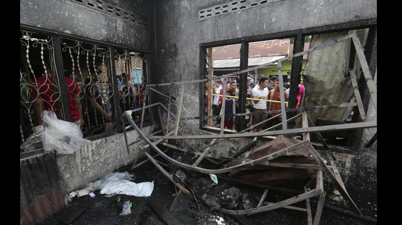 At least two dozen people were killed when a fire ripped through a matchstick warehouse in Indonesia on Friday, authorities said. (Photo: AP) At least two dozen people were killed when a fire ripped through a matchstick warehouse in Indonesia on Friday, authorities said. (Photo: AP)