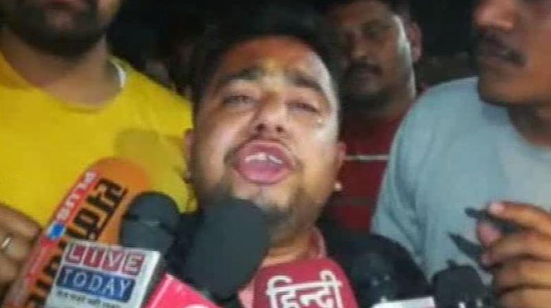 Speaking to ANI, Ashish Pathak, HVY district coordinator alleged that Congress workers brutally thrashed him in public. (Image: ANI) Speaking to ANI, Ashish Pathak, HVY district coordinator alleged that Congress workers brutally thrashed him in public. (Image: ANI)