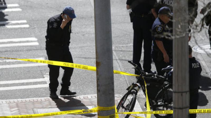 Authorities closed off several downtown blocks throughout the afternoon as police cruisers flooded the area and SWAT officers searched a nearby federal building where the suspect had barricaded himself inside. (Photo: AP) Authorities closed off several downtown blocks throughout the afternoon as police cruisers flooded the area and SWAT officers searched a nearby federal building where the suspect had barricaded himself inside. (Photo: AP)