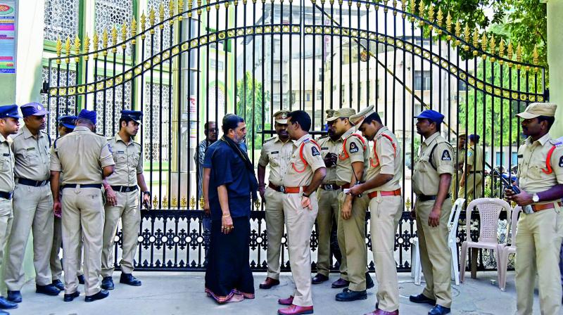 Police personnel stand guard at the haj house that houses the TS Wakf Board at Nampally. Police personnel stand guard at the haj house that houses the TS Wakf Board at Nampally.
