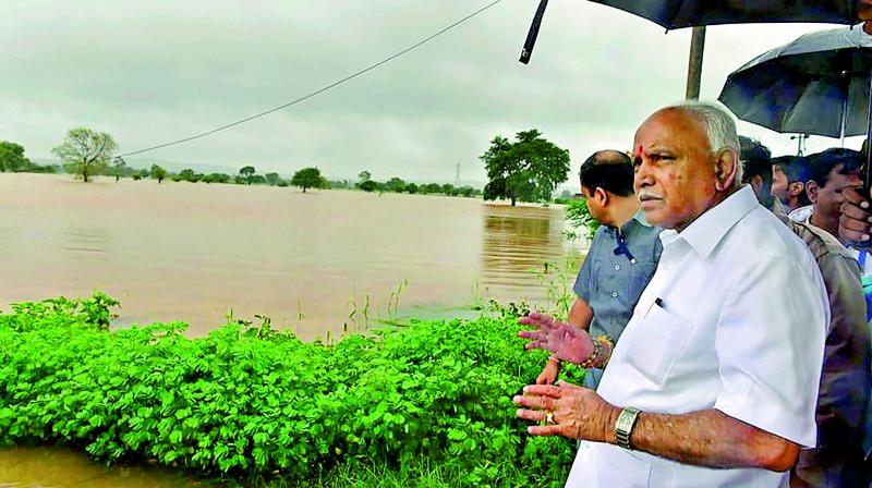 Karnataka Chief Minister B.S. Yediyurappa visits flood-affected areas of Belgaum on Thursday. (PTI) Karnataka Chief Minister B.S. Yediyurappa visits flood-affected areas of Belgaum on Thursday. (PTI)