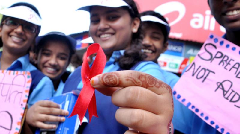 A School girl displays a red ribbon (Representational Image) A School girl displays a red ribbon (Representational Image)