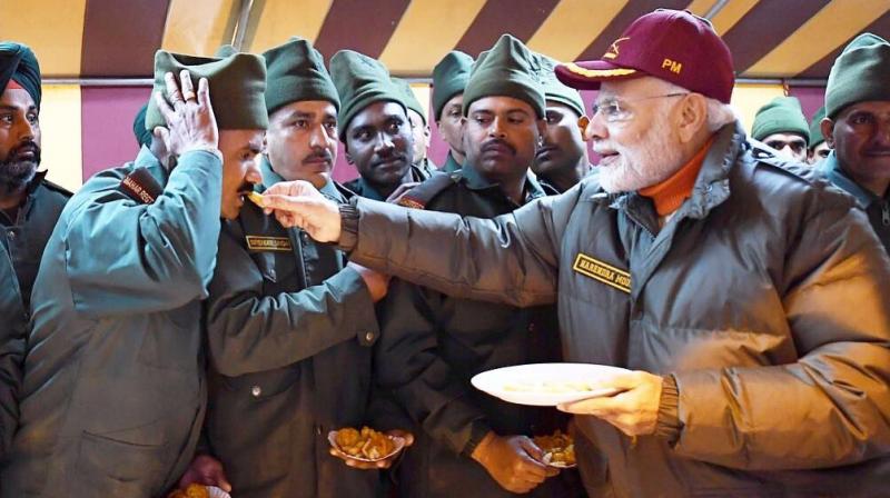 Prime Minister Narendra Modi celebrated Diwali with soldiers in Harsil near Indo-China border. (Photo: Twitter | @narendramodi) Prime Minister Narendra Modi celebrated Diwali with soldiers in Harsil near Indo-China border. (Photo: Twitter | @narendramodi)
