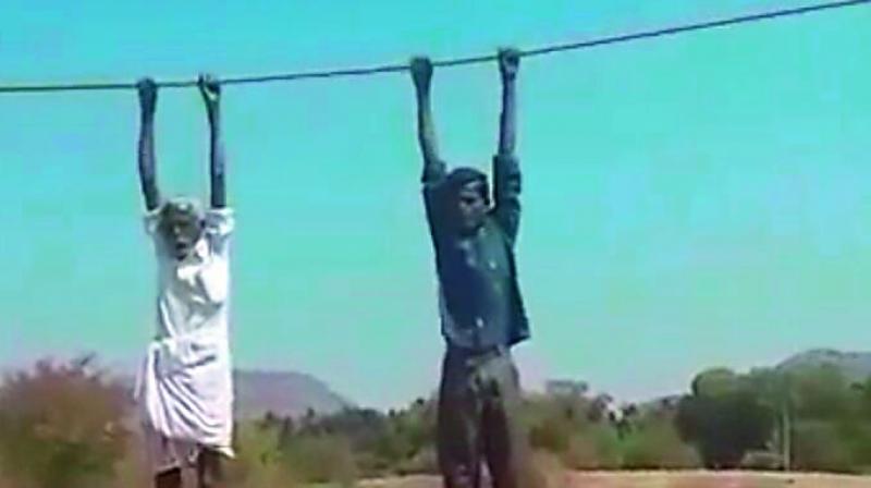 Anantapur: Protesting farmers hoisted on power 