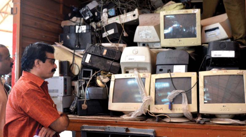 Education minister C. Raveendranath takes a look at the E-waste collected from schools after a collection programme at GGHSS Cotton Hill in Thiruvananthapuram, Nearly three tonnes of E waste was collected from city schools in the city. (Photo: DC) Education minister C. Raveendranath takes a look at the E-waste collected from schools after a collection programme at GGHSS Cotton Hill in Thiruvananthapuram, Nearly three tonnes of E waste was collected from city schools in the city. (Photo: DC)