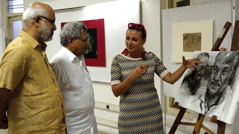 Russian painter Maltseva Evgeniya introduces her work to CPI(M) general secretary Sitaram Yechury and CPM politburo member M.A. Baby. Russian painter Maltseva Evgeniya introduces her work to CPI(M) general secretary Sitaram Yechury and CPM politburo member M.A. Baby.