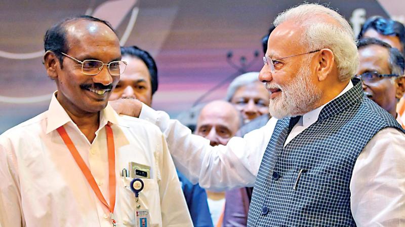 Prime Minister Narendra Modi interacts with ISRO Chairman Kailasavadivoo Sivan after connection with the Vikram lander was lost during soft landing of Chandrayaan 2 on lunar surface, in Bengaluru on Saturday. (Photo: PTI) Prime Minister Narendra Modi interacts with ISRO Chairman Kailasavadivoo Sivan after connection with the Vikram lander was lost during soft landing of Chandrayaan 2 on lunar surface, in Bengaluru on Saturday. (Photo: PTI)
