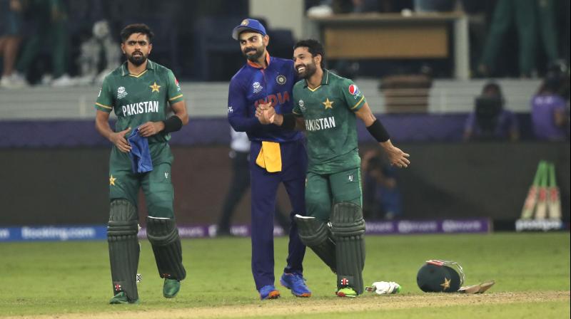 Indian cricket captain Virat Kohli congratulates Pakistans Mohammad Rizwan at the end of the Cricket Twenty20 World Cup match between India and Pakistan in Dubai on Sunday. (Photo: AP/File)