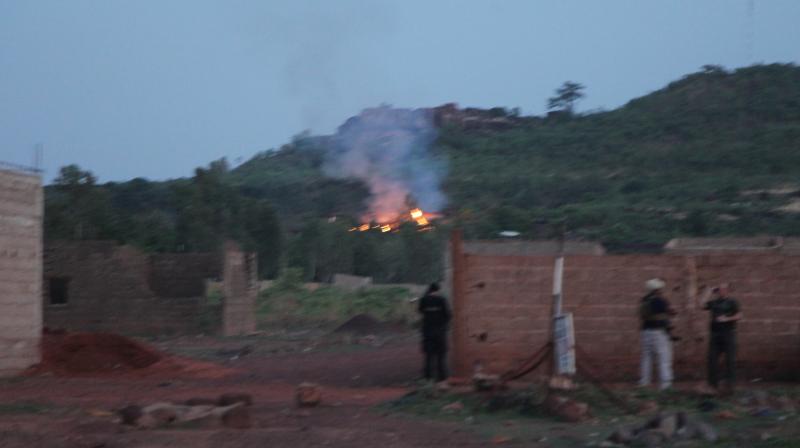 Fire can be seen by the swimming pool of the Campement Kangaba, a tourist resort near Bamako, Mali (Photo: AP) Fire can be seen by the swimming pool of the Campement Kangaba, a tourist resort near Bamako, Mali (Photo: AP)