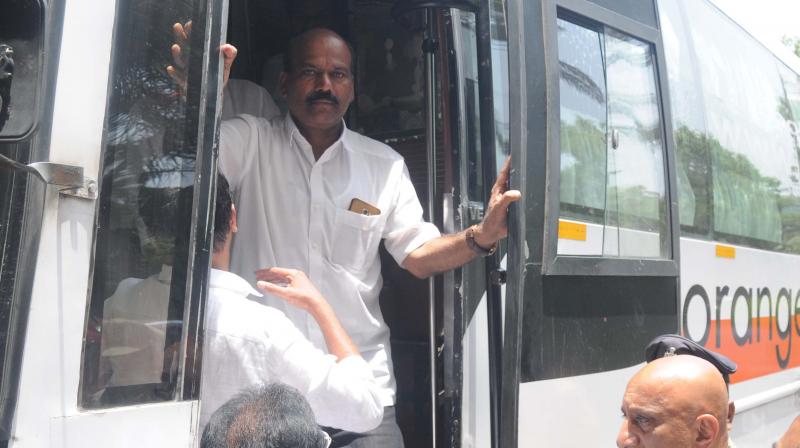 Karnataka Congress MLAs getting down from a bus in a private hotel in Hyderabad on Friday. (Photo: Deepak Deshpande) Karnataka Congress MLAs getting down from a bus in a private hotel in Hyderabad on Friday. (Photo: Deepak Deshpande)