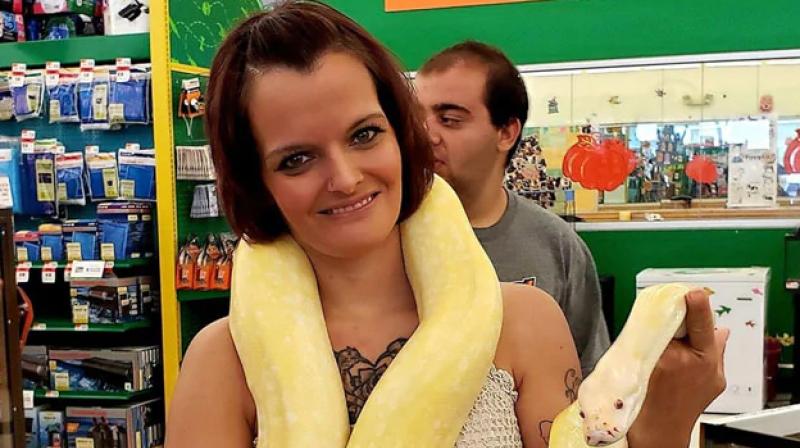 A 36-year-old woman has been found dead with a python wrapped around her neck in a home in the mid-western US state of Indiana which housed around 140 snakes, police said. (Photo: Facebook/ LauraHust) A 36-year-old woman has been found dead with a python wrapped around her neck in a home in the mid-western US state of Indiana which housed around 140 snakes, police said. (Photo: Facebook/ LauraHust)