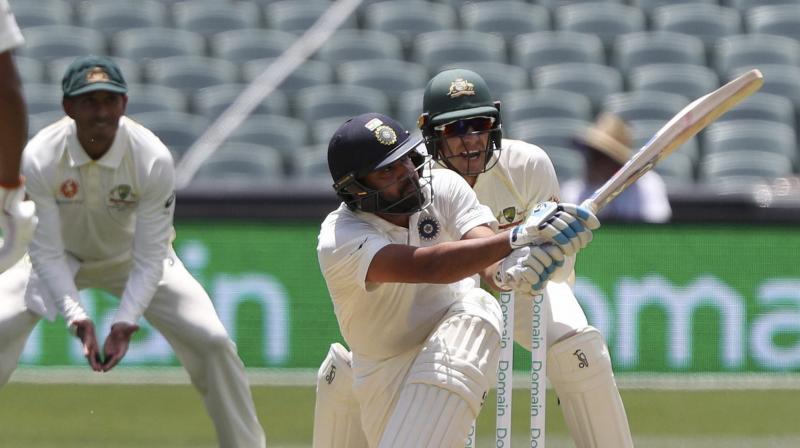 While Pujara was sedate at one end, Rohit took the lead in scoring as he hit sixes at will. (Photo: AP) While Pujara was sedate at one end, Rohit took the lead in scoring as he hit sixes at will. (Photo: AP)