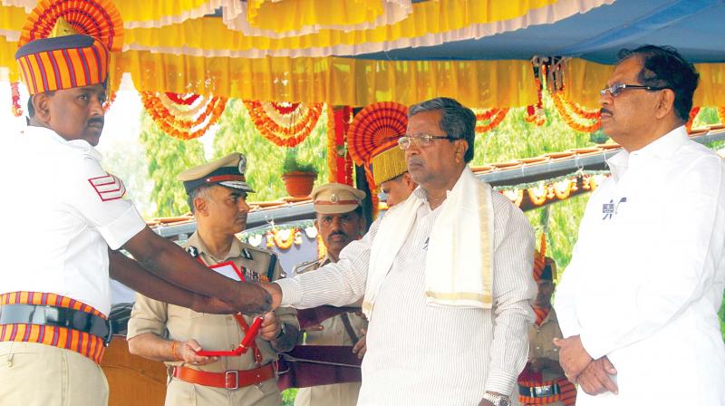 Chief Minister Siddaramaiah and Home Minister Dr.G.Parameshwar during the Police Flag Day at KSRP Ground in Koramangala in the city on Sunday.(Photo: DC) Chief Minister Siddaramaiah and Home Minister Dr.G.Parameshwar during the Police Flag Day at KSRP Ground in Koramangala in the city on Sunday.(Photo: DC)