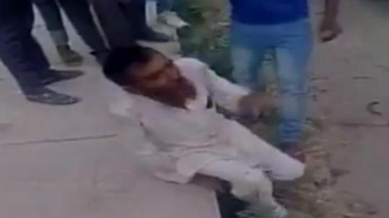 A mob of cow vigilantes associated with the Bajrang Dal and Vishwa Hindu Parishad (VHP) beat up Pehlu Khan and 4 others badly. (Photo: Videograb) A mob of cow vigilantes associated with the Bajrang Dal and Vishwa Hindu Parishad (VHP) beat up Pehlu Khan and 4 others badly. (Photo: Videograb)