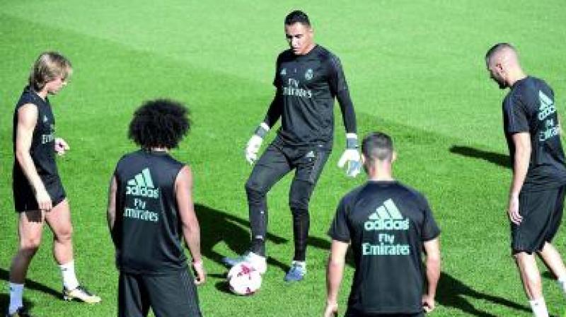 Real Madrid players at a training session in Madrid on Tuesday, the eve of their Spanish Super Cup second leg match against Barcelona. (Photo: AFP) Real Madrid players at a training session in Madrid on Tuesday, the eve of their Spanish Super Cup second leg match against Barcelona. (Photo: AFP)