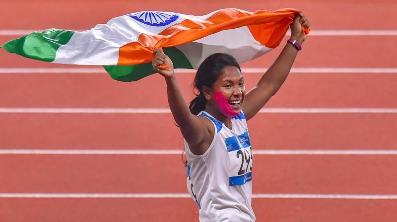Competing with a plastered face owing to a teeth injury, described as a a case of infection, the battle-hardened Swapna topped the overall standings to garb her maiden Asiad gold. (Photo: PTI) Competing with a plastered face owing to a teeth injury, described as a a case of infection, the battle-hardened Swapna topped the overall standings to garb her maiden Asiad gold. (Photo: PTI)